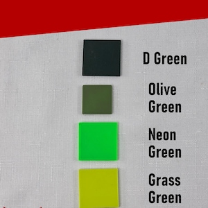 May include: A color chart displaying four square samples in shades of green labeled D Green, Olive Green, Neon Green, and Grass Green. The text Color Options appears at the top, and the Silver Harmony Studios LLC logo is at the bottom left.