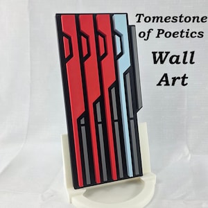May include: Geometric wall art with a black, red, and light blue design. The artwork is mounted on a white stand. Text on the art reads "TomeStone of Poetics Wall Art".