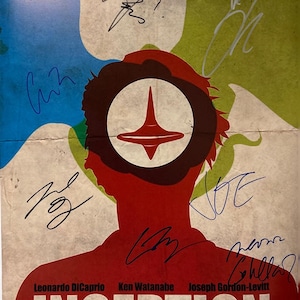 May include: A signed movie poster for the film Inception, featuring a silhouette of a person with a spinning top in their head. The poster is signed by Leonardo DiCaprio, Ken Watanabe, Joseph Gordon-Levitt, and Christopher Nolan.