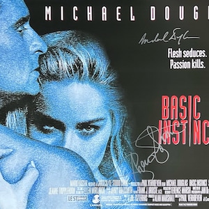 May include: A movie poster for the film "Basic Instinct" starring Michael Douglas. The poster features a close-up of Douglas and Sharon Stone, with the title of the film in red letters. The tagline "Flesh seduces. Passion kills." is also featured on the poster.