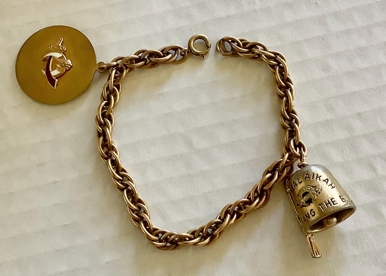 Vintage mid century gold metal Shriners Al Malaikah bell charm bracelet dated 1960