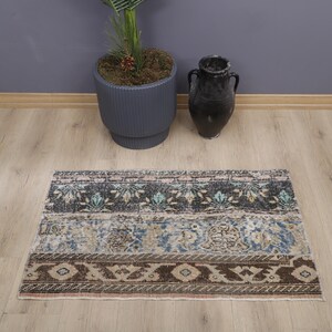 Vintage Turks Oushak-minitapijt: deurmat van 2 x 4 watten