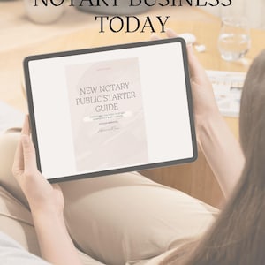 May include: A tablet displaying a guide titled "New Notary Public Starter Guide." The text "Star Your Notary Business Today" is at the top. The tablet is held by a person wearing tan pants.