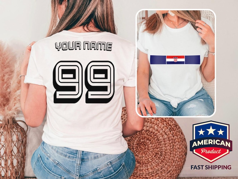 May include: A white t-shirt featuring the text YOUR NAME and the number 99 in a bold black font on the back. The front of the shirt displays a horizontal blue stripe with the Croatian flag centered within it. The shirt is shown in two views.