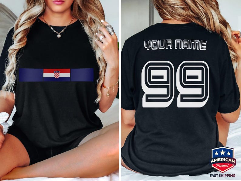 May include: A black short-sleeved t-shirt featuring a horizontal stripe with the Croatian flag on the front. The back of the shirt displays the text YOUR NAME above the large white number 99 in a bold, block-style font with a black outline.