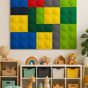 May include: A colorful wall decor piece resembling large toy building blocks. The blocks are in shades of blue, red, yellow, green, and gray. Below, a white shelf displays toys, storage bins, and a rainbow rug, creating a playful nursery or playroom setting.