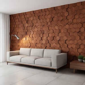 May include: A modern living room featuring a light gray sofa with wooden legs, set against a wall of brown hexagonal wood panels. A floor lamp and side table with plants complete the decor.