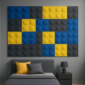 May include: A wall-mounted art piece composed of large, colorful blocks in blue, yellow, and gray, resembling oversized toy bricks. The blocks are arranged in a grid pattern. Below, a bed with yellow and gray pillows.