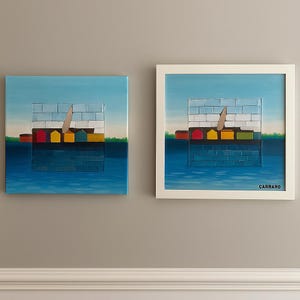 May include: Two abstract paintings depicting a waterfront scene with colorful buildings and a sailboat against a blue sky. One painting is framed in white, the other is unframed. The paintings have a textured appearance, with the artist's signature "CARRARO" visible on the framed piece.