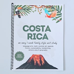 May include: A white spiral bound book with the title "COSTA RICA" in green text. The book is an easy 1-week family style unit study that includes language arts, maths, science, art, Spanish, history, sustainability, handwriting, sensory play, and geography. The cover also features a colourful illustration of a toucan, a parrot, and a volcano.