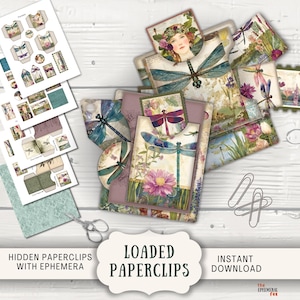 Può includere: Una collezione di graffette, efemeridi e fogli di carta stampata con disegni di libellule e fiori. L'immagine include il testo "LOADED PAPERCLIPS" e "HIDDEN PAPERCLIPS WITH EPHEMERA". La tavolozza dei colori comprende sfumature di viola, verde e rosa.