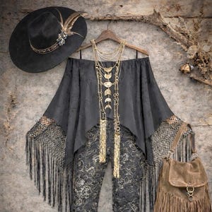 May include: A black off-the-shoulder top with lace fringe sleeves, black and gold floral lace flare trousers, a black wide-brim hat with feathers, a layered gold moon necklace, a brown suede fringe handbag, and black lace-up knee-high boots.