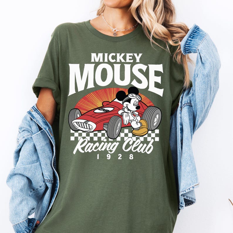 a woman wearing a mickey mouse racing club shirt