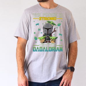 Personalized The Force Is Strong With This Dadalorian Shirt, Mandalorian Dad T-Shirt With Kids Names, Star Wars Father Day Tees Gift