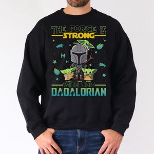 Personalized The Force Is Strong With This Dadalorian Shirt, Mandalorian Dad T-Shirt With Kids Names, Star Wars Father Day Tees Gift