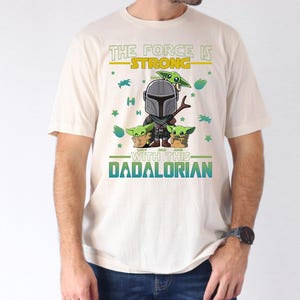 Personalized The Force Is Strong With This Dadalorian Shirt, Mandalorian Dad T-Shirt With Kids Names, Star Wars Father Day Tees Gift