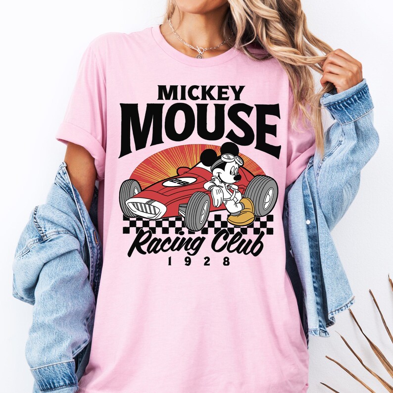 a woman wearing a mickey mouse racing club shirt