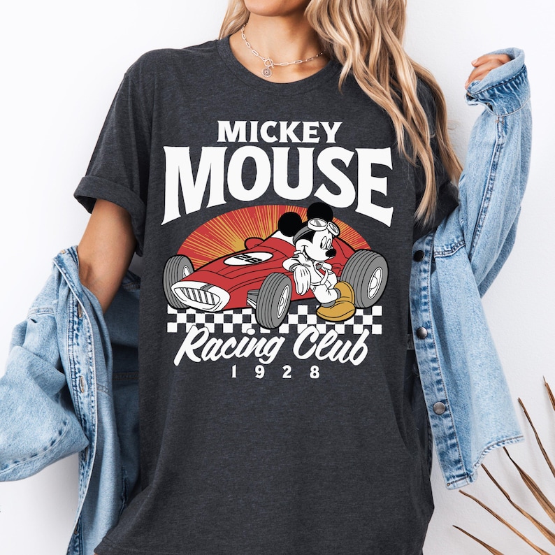 a woman wearing a mickey mouse racing club shirt