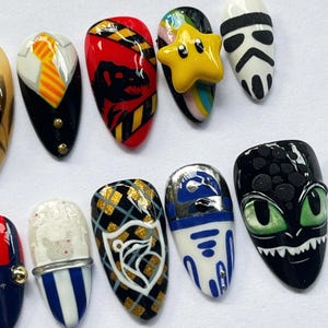 geek press on nails, movie character nails, cosplay nail art set, dragon nails, character press on nails, geek nail art, movie inspired nails, game inspired nails, custom cosplay nails, fan art nail set, unique press on nails, collector nail art, custom nerd nails