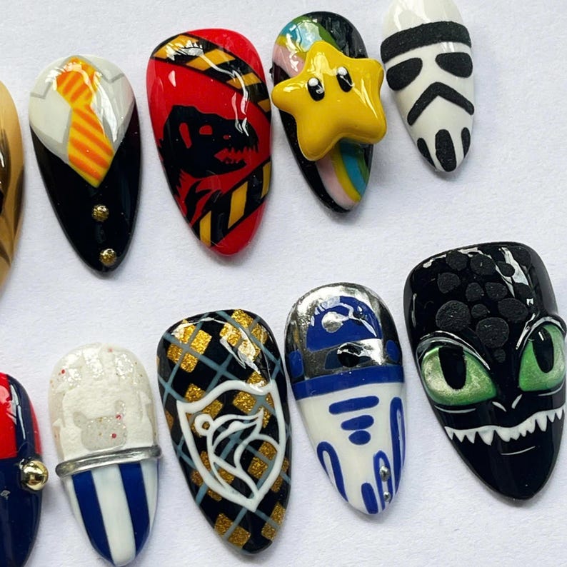 geek press on nails, movie character nails, cosplay nail art set, dragon nails, character press on nails, geek nail art, movie inspired nails, game inspired nails, custom cosplay nails, fan art nail set, unique press on nails, collector nail art, custom nerd nails