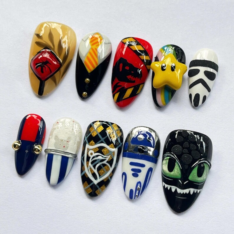 geek press on nails, movie character nails, cosplay nail art set, dragon nails, character press on nails, geek nail art, movie inspired nails, game inspired nails, custom cosplay nails, fan art nail set, unique press on nails, collector nail art, custom nerd nails