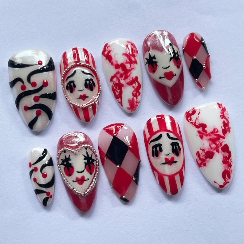 halloween press on nails, creepy clown fake nails, harlequin nail art, red black white nails, spooky costume nails, handmade halloween nails, circus clown nails, cosplay press on nails, gothic carnival nails, party fake nails set, scary clown nail art, unique halloween nails, spooky cosplay nails, holiday nails, canival nails, party nails