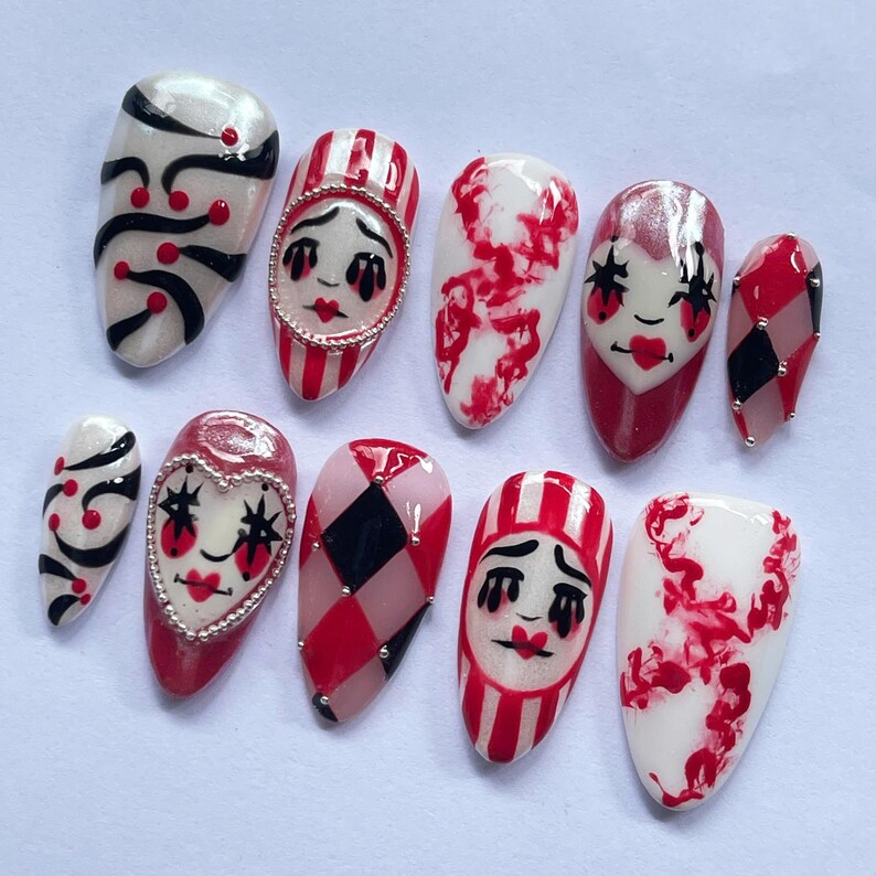 halloween press on nails, creepy clown fake nails, harlequin nail art, red black white nails, spooky costume nails, handmade halloween nails, circus clown nails, cosplay press on nails, gothic carnival nails, party fake nails set, scary clown nail art, unique halloween nails, spooky cosplay nails, holiday nails, canival nails, party nails