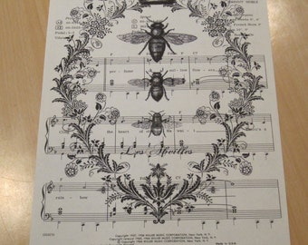 french crown with bees on vintage sheet music