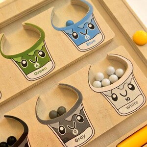 Complete Montessori color sorting set with wooden board, magnetic wand, and counters, hands-on preschool toy