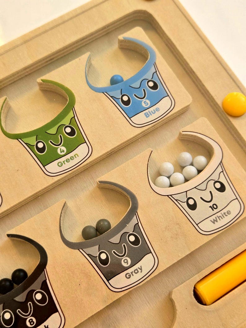 Complete Montessori color sorting set with wooden board, magnetic wand, and counters, hands-on preschool toy