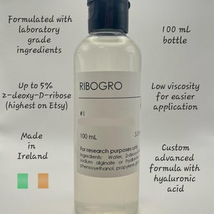 May include: A clear 100 ml bottle of Ribogro liquid with a black cap. The label includes text about the ingredients, including hyaluronic acid, and states it is made in Ireland. The product is formulated with laboratory grade ingredients.