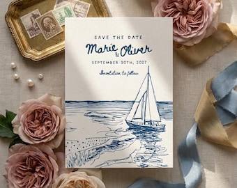 May include: A rectangular Save the Date card featuring a blue ink illustration of a sailboat on the water. The text reads: SAVE THE DATE, Marie & Oliver, SEPTEMBER 30TH, 2027, Invitation to follow. The card is surrounded by pink roses and blue ribbon.