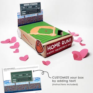 May include: A baseball-themed Valentine's Day box with a stadium scoreboard, baseball field design, and the text "HOME RUN!! HAPPY VALENTINE'S DAY." Includes pink heart cutouts and instructions.