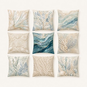 May include: Nine square cushions with coastal designs. The cushions feature various patterns, including seashells, coral, and abstract wave-like designs in shades of beige, blue, and white. The cushions are arranged in a grid.