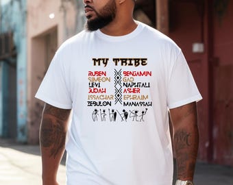 May include: White t-shirt with the text "My Tribe" in black and red. The names of the 12 tribes of Israel are listed in two columns, with a stylized tribal symbol between them.  The names are in black and the symbol is in brown.
