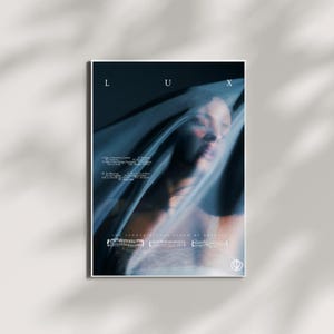 May include: A poster with a woman's face partially obscured by a sheer fabric. The word "LUX" is at the top, with a list of song titles below. The text "THE FOURTH STUDIO ALBUM BY ROSALÍA" is at the bottom, with a musical staff design.