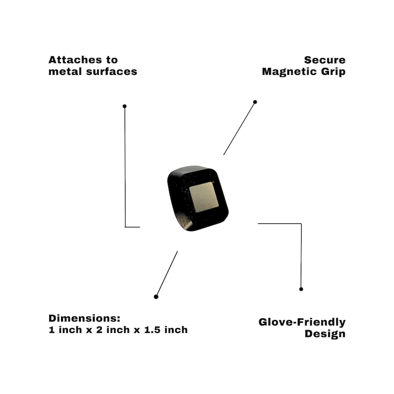 May include: A black, square-shaped object with a silver square inset. The text indicates it attaches to metal surfaces with a secure magnetic grip and has a glove-friendly design. Dimensions are 1 inch x 2 inches x 1.5 inches.