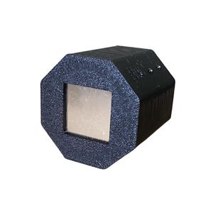 May include: A black, geometric-shaped object with a square, metallic-looking center. The object has a textured surface and appears to be made of a rigid material. The design is modern and industrial.