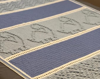 Manta de dinosaurio para bebé a crochet