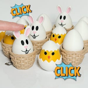 May include: A set of Easter-themed egg-shaped toys with bunny and chick faces. The eggs are in woven baskets and have a click sound when pressed. The text "CLICK" is in a speech bubble.