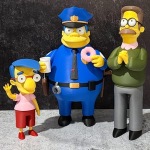 May include: Three cartoon character figurines: a police officer in blue, a man in a green sweater, and a boy in a pink shirt. The police officer holds a donut and a coffee cup. The boy waves, and the man clasps his hands.