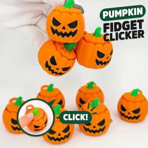 May include: A collection of orange pumpkin-shaped fidget clickers with green stems and black jack-o'-lantern faces. The text PUMPKIN FIDGET CLICKER and CLICK! is visible. Each small, round toy features a textured surface and a top button mechanism.