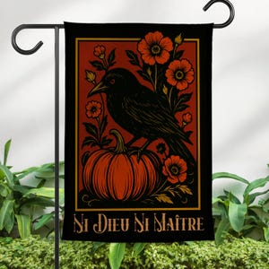 May include: Black garden flag featuring a raven perched on an orange pumpkin, surrounded by orange flowers and foliage. The flag has a red background with a gold border and the text "Ni Dieu Ni Maître" in gold.