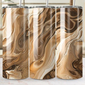 May include: Three stainless steel tumblers with a brown and white marbled design. The tumblers are lined up in a row on a white surface.