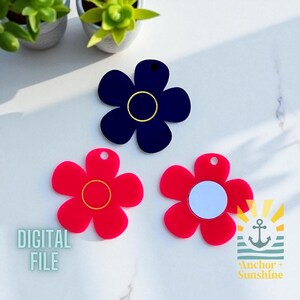 May include: Three flower-shaped acrylic charms in red and navy blue. The navy blue charm has a gold center ring. The red charms have gold and white centers. The words "DIGITAL FILE" are printed on the left side of the image.