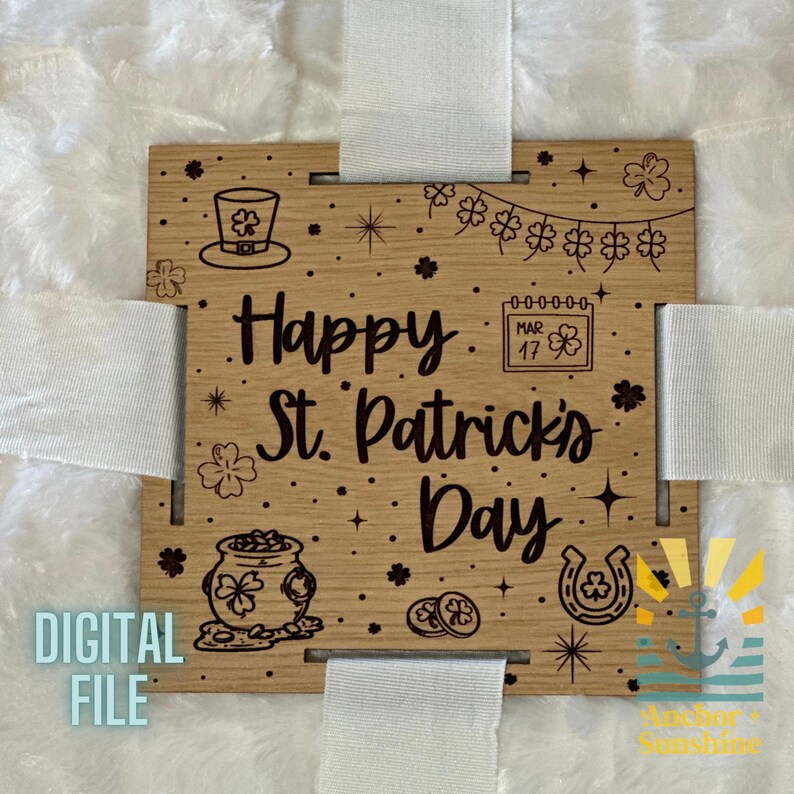 May include: A wooden sign with a white ribbon attached to each corner. The sign has a St. Patrick's Day theme with a shamrock, pot of gold, and horseshoe. The text on the sign reads "Happy St. Patrick's Day".
