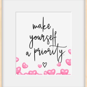 May include: A white background with the text "make yourself a priority." in black cursive font. Pink hearts are scattered around the text.