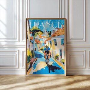 Ciclista in un villaggio francese, arte murale colorata dedicata al ciclismo, poster di un giro in bicicletta nella campagna francese, regalo per ciclisti, arte del Tour de France,