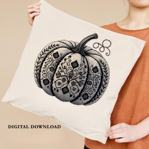 Mockup of pillow with printed Halloween pumpkin embroidery design, perfect gothic home decoration.