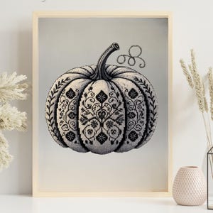 Wall art featuring ornamental pumpkin as refined monochrome decor.